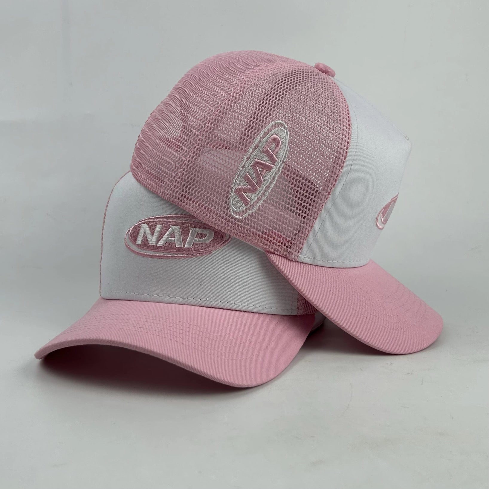 NAP trucker cap in baby pink colourway